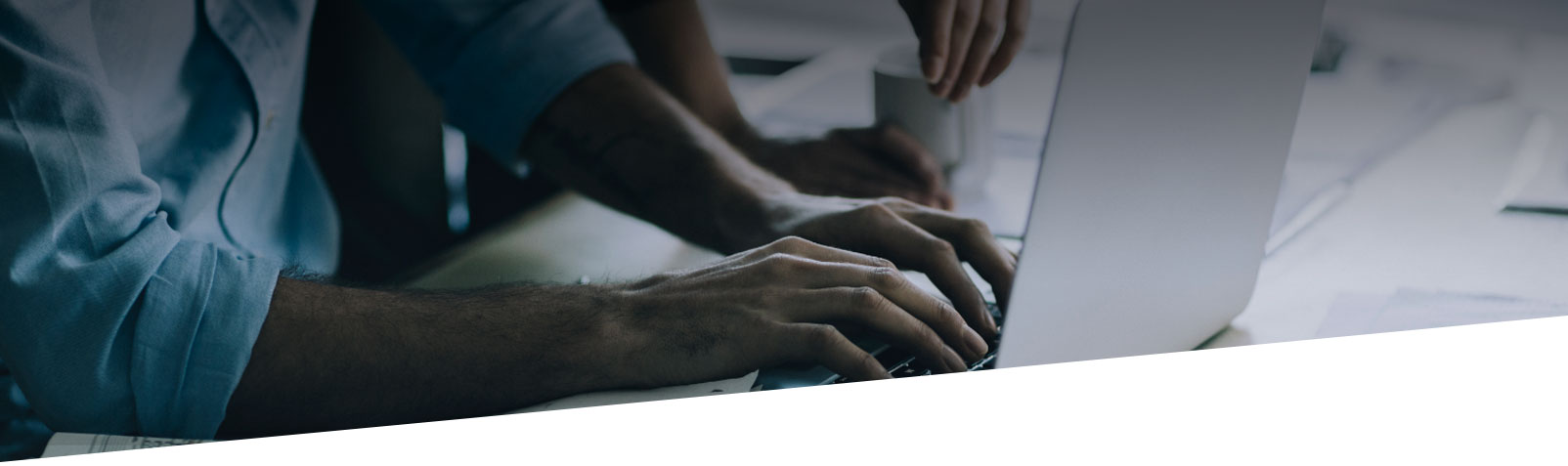 engineers designing plans on laptop