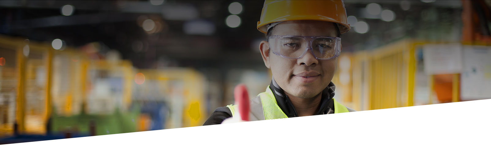 engineer with thumbs up in factory